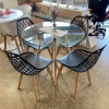 Juego Mesa Eames Vidrio 0.90 diam. + 4 Sillas Nova Tulip Negras