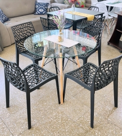 Juego Mesa Eames Vidrio 0.90 diam. + 4 Sillas Mikonos Negras